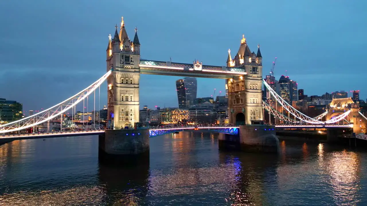 Orbital drone shot of the Tower Bridge in London England at night