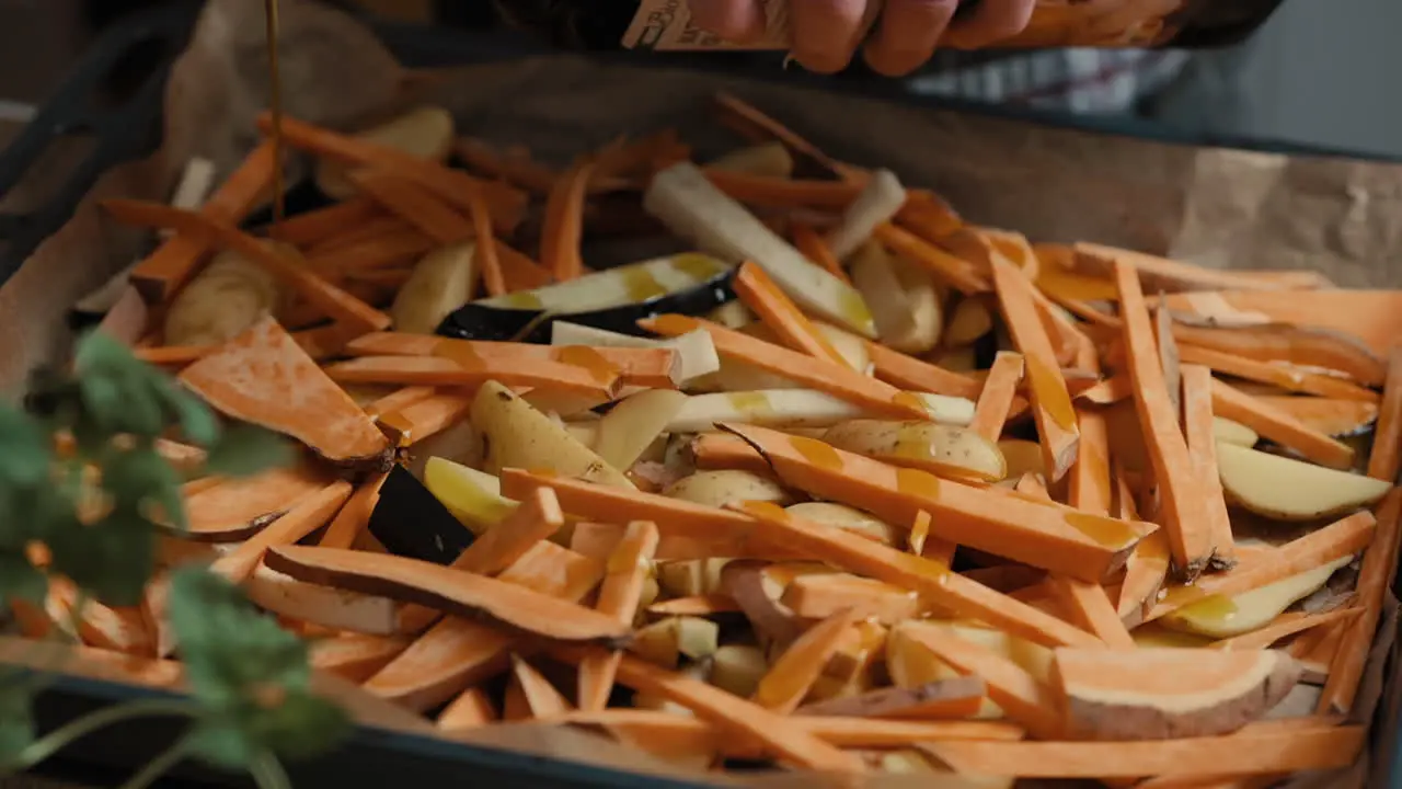 Slow-Motion Footage Of A Chef Pouring Olive Oil Over Vegetables cooking a healthy meal