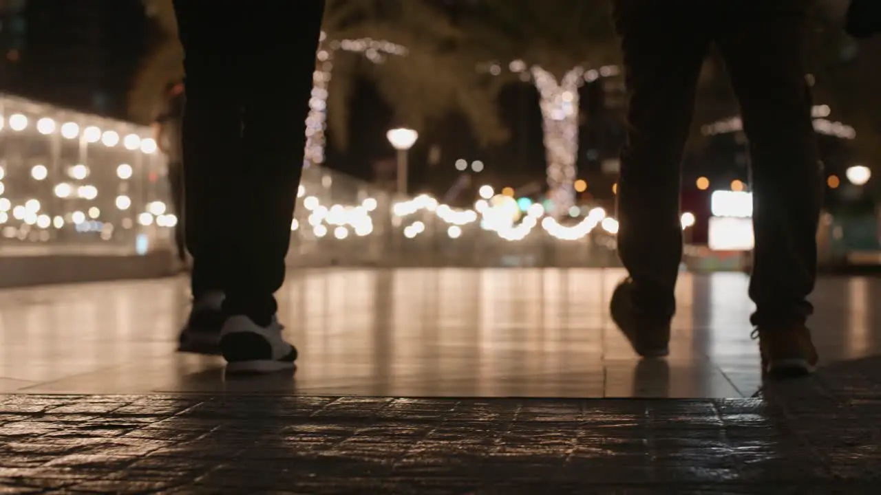 Men Walking On The Night Street Lights and Palm Trees