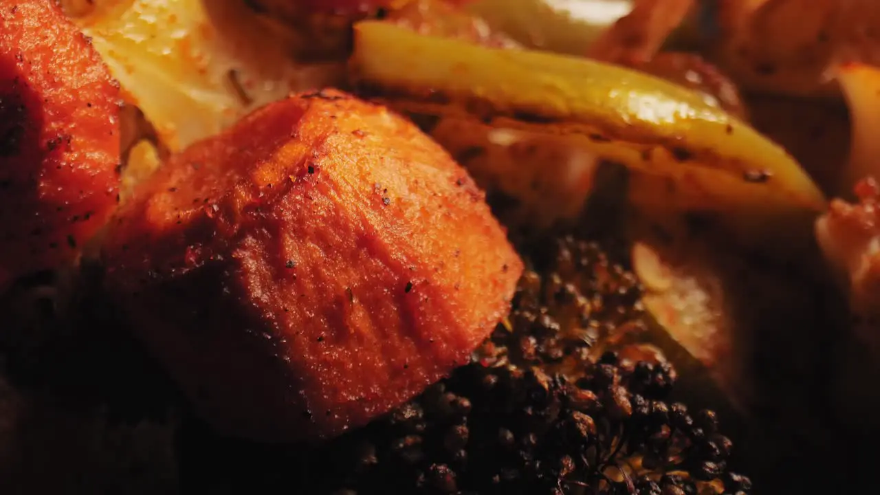 Vibrant close-up of grilled veggies bell peppers zucchini carrots seasoned with herbs and spices