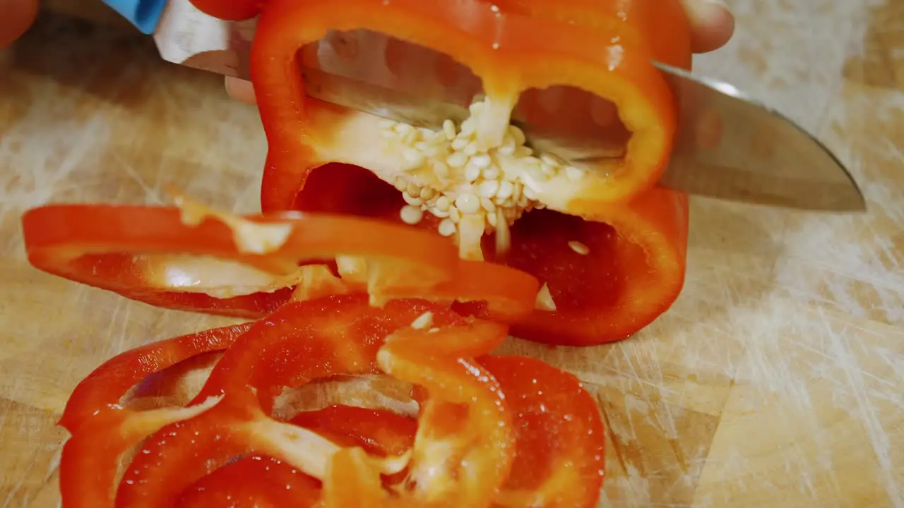 Motion controlled shot of cutting red paprika