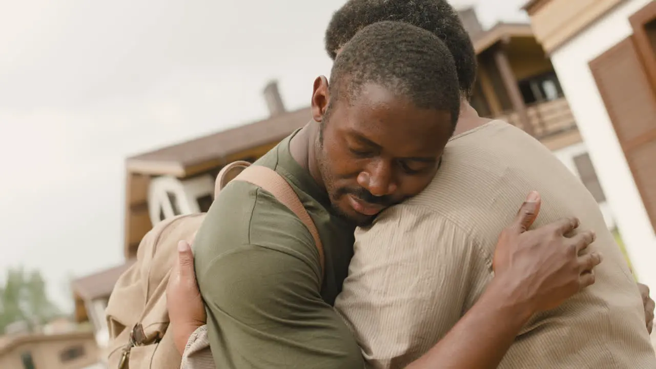 Portrait Of Male Soldier Hugging His Mom Before Going To Military Service