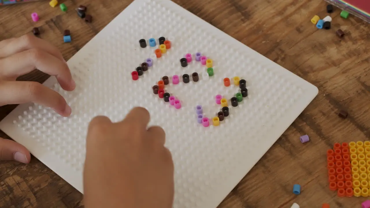 Close Up Shot Of The Hands Of A Little Girl Playing With Colored Beads And Typing Numbers 1 2 3