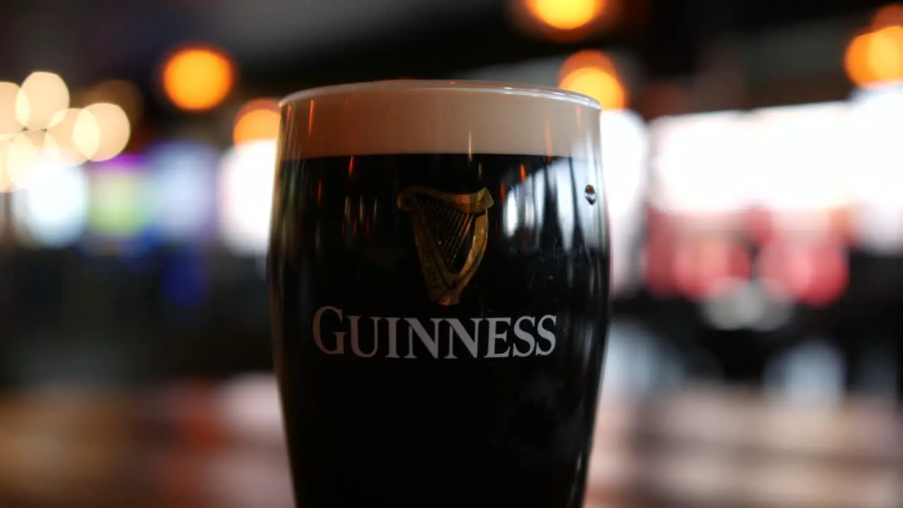 A pint of Guinness beer stout on St Patrick's day in an Irish pub in Ireland