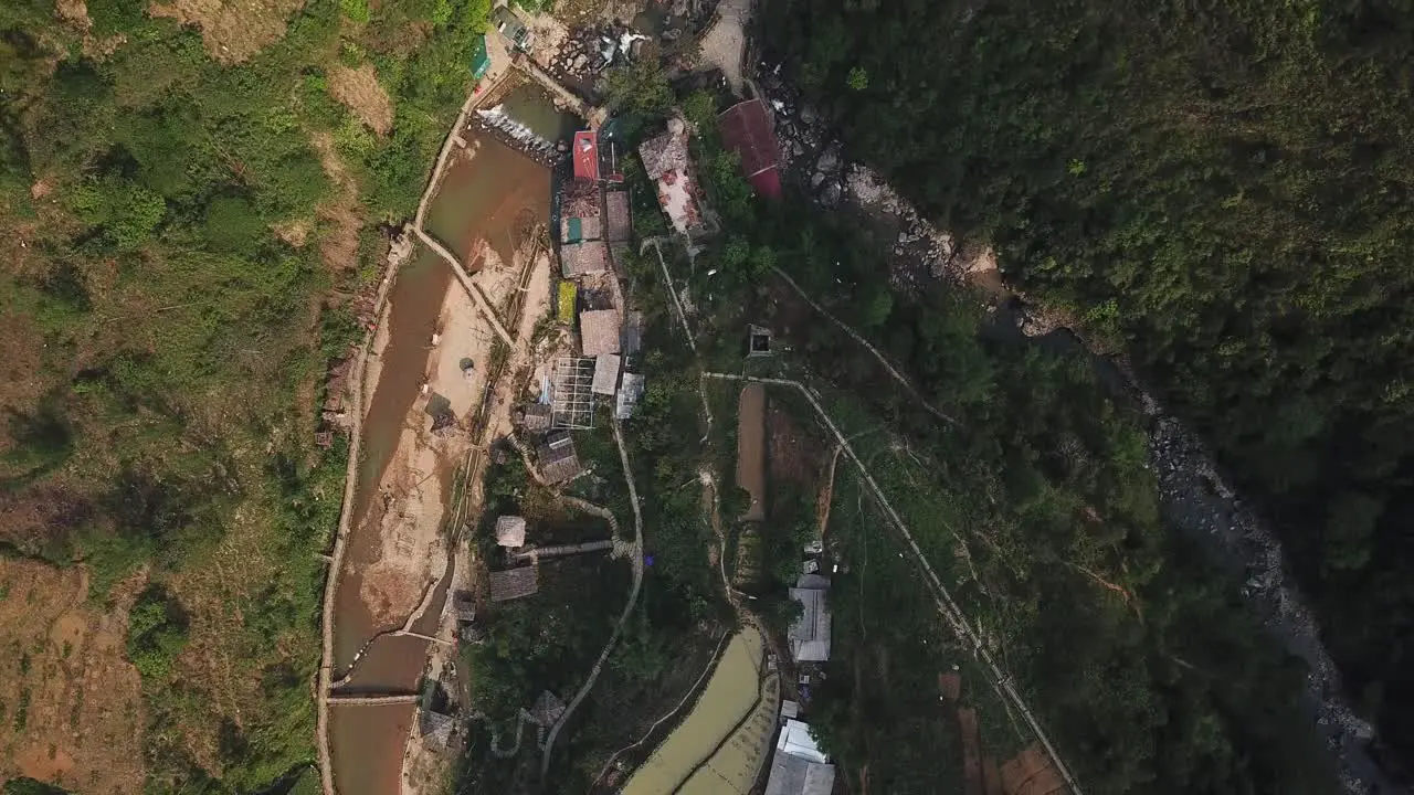 Overhead view of Cat Cat Village and a brown river in Sapa Vietnam