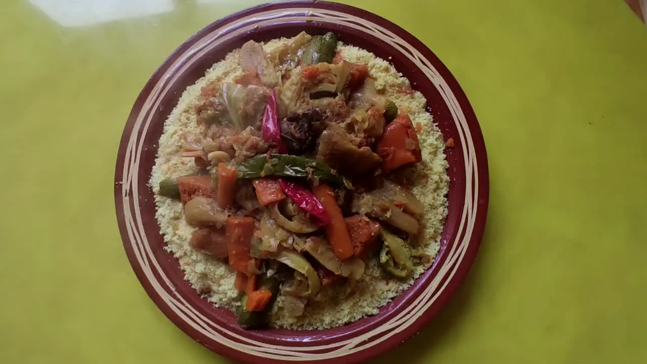 Couscous meal with meat and vegetables in a traditional Arabic plate Morocco -1