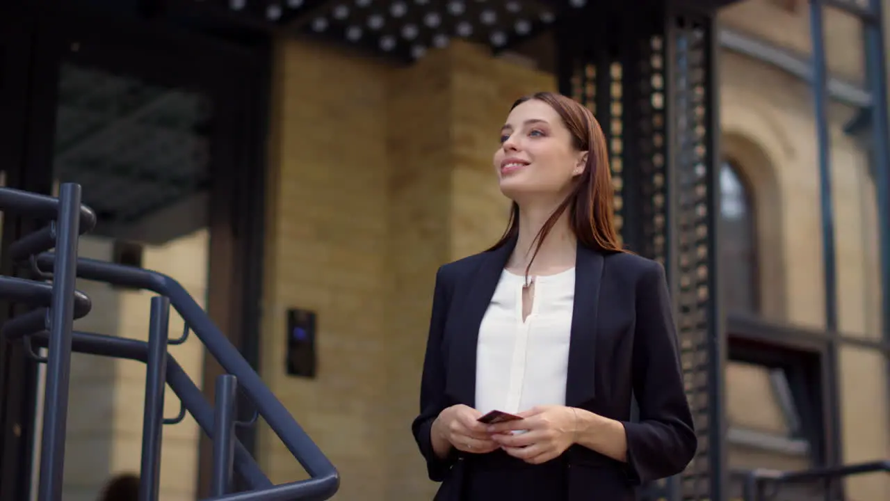 Business woman meeting with courier outside Lady paying card for food delivery