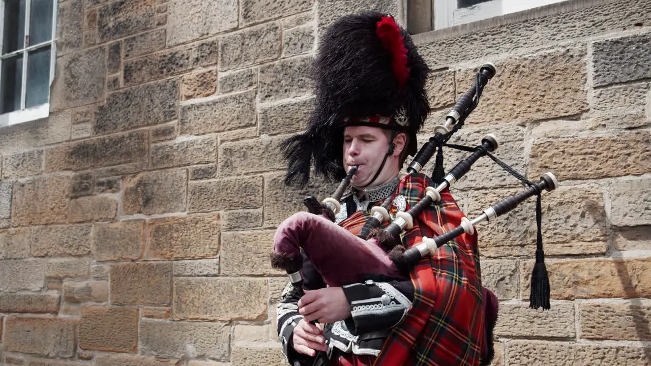 A traditional Scotsman plays a bagpipe in Edinburgh