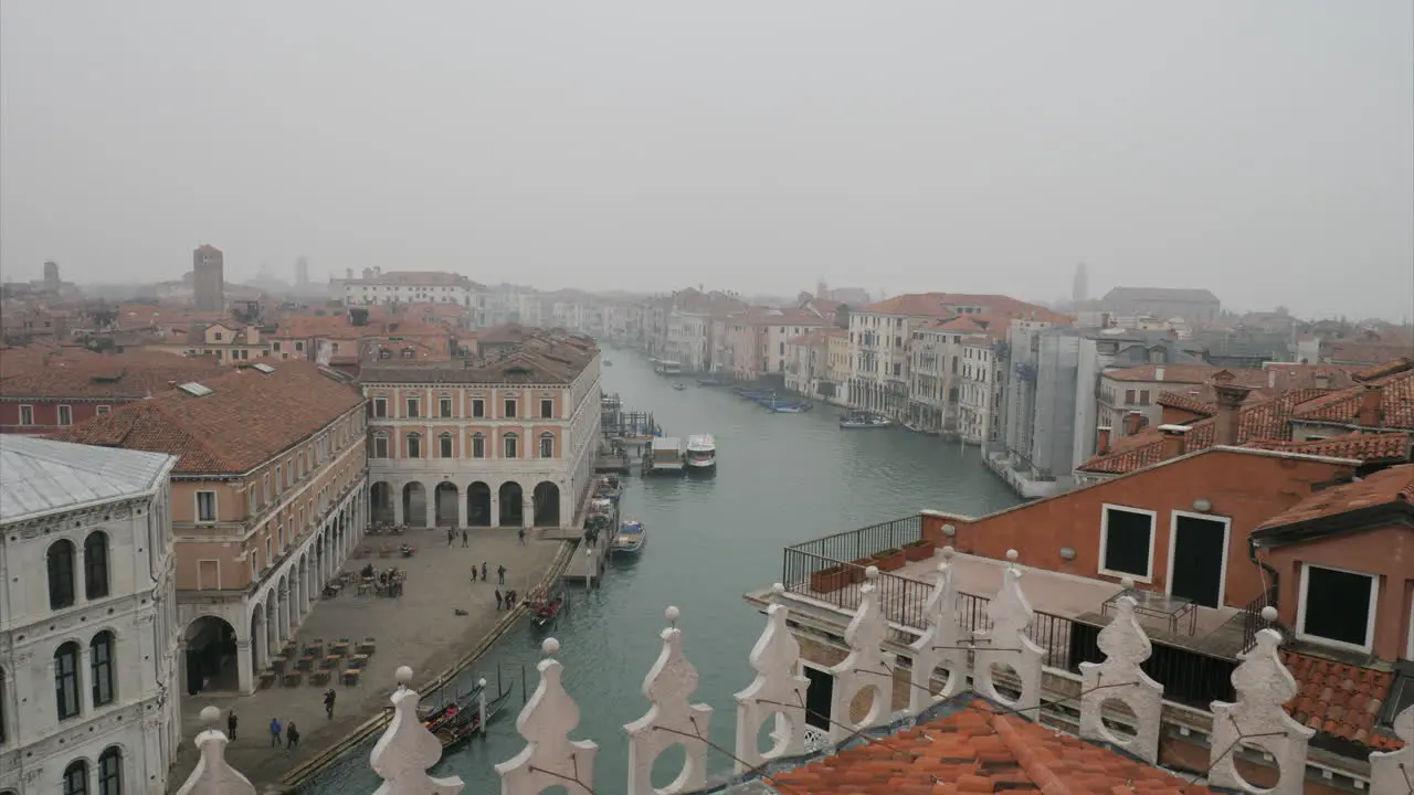 Slowly tilting down shot on Venice from Rialto Hotel terrace on a cloudy day