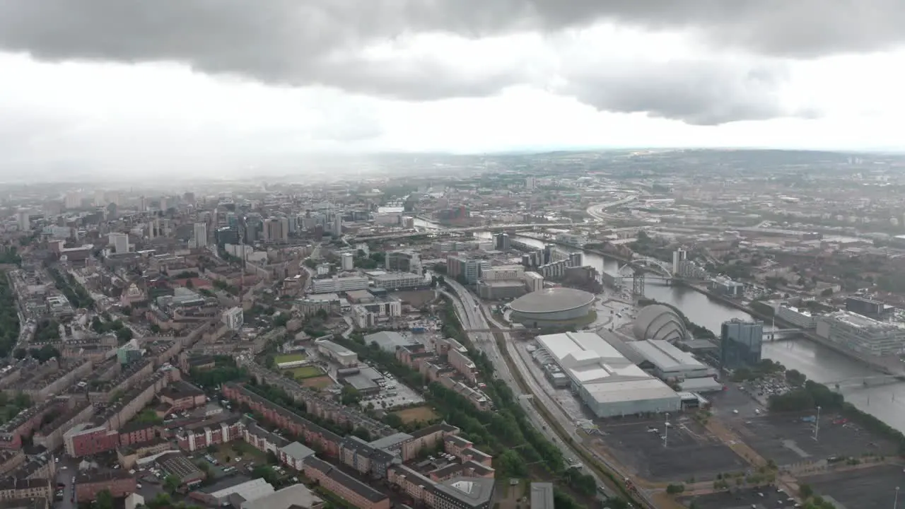 Descending drone shot over central Glasgow in the rain