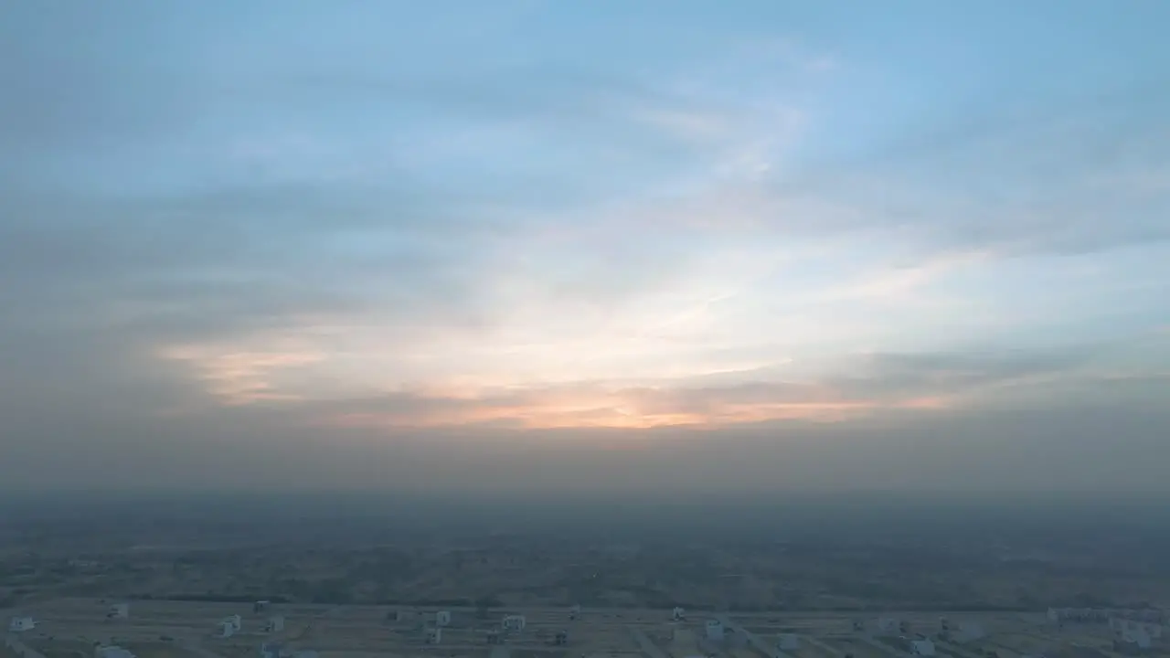 Sunset view is hidden behind the clouds and city pollution in a big city of Pakistan Karachi Pakistan