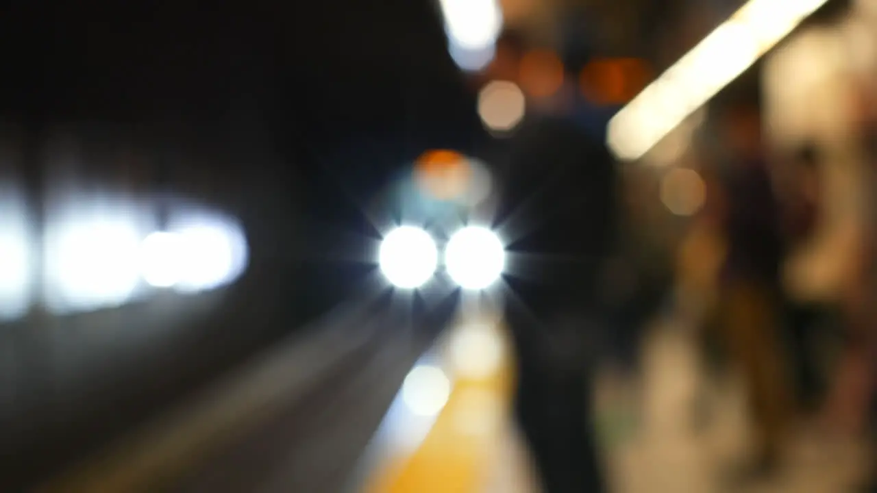 Blurred commuters waiting for train on subway platform 4k