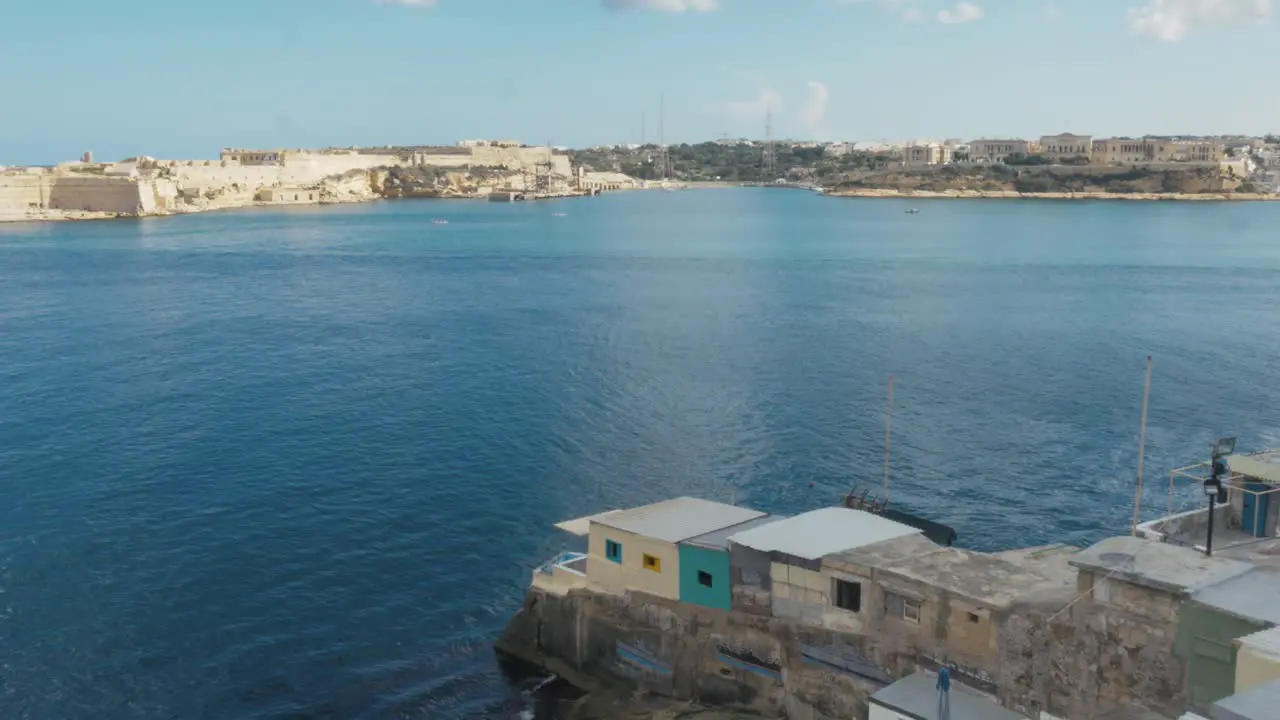 Wide shot of a Valletta bay where cruiseships enter the harbour of the city