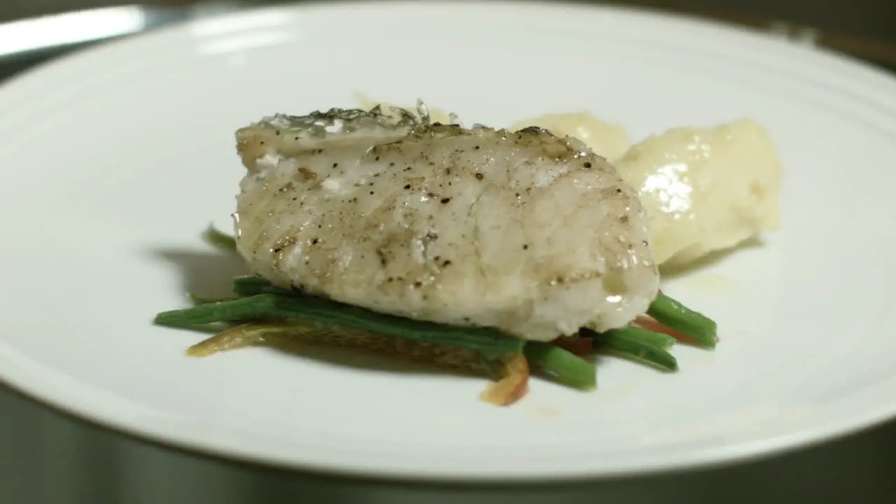 Food Presentation Of Steamed Fish Dish