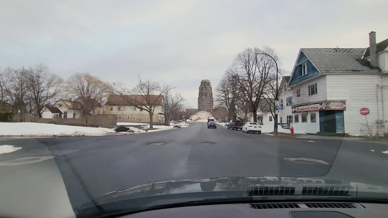 Driving through the streets of the city of Buffalo in New York after heavy snowfall