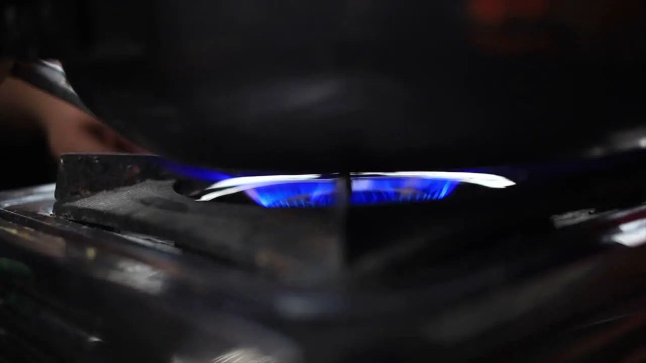 Hot blue flame came out whenThe chef switch on the stove with a lighter