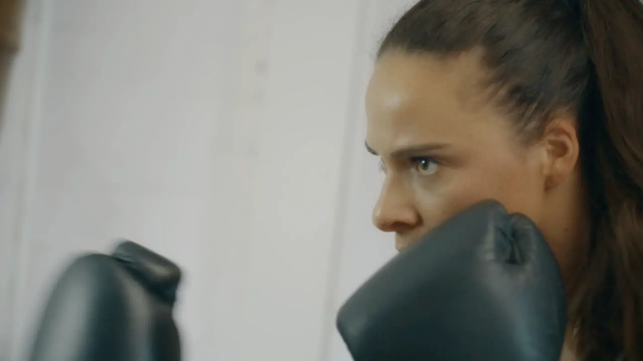 Female Boxer Punching Bag in Slow Motion