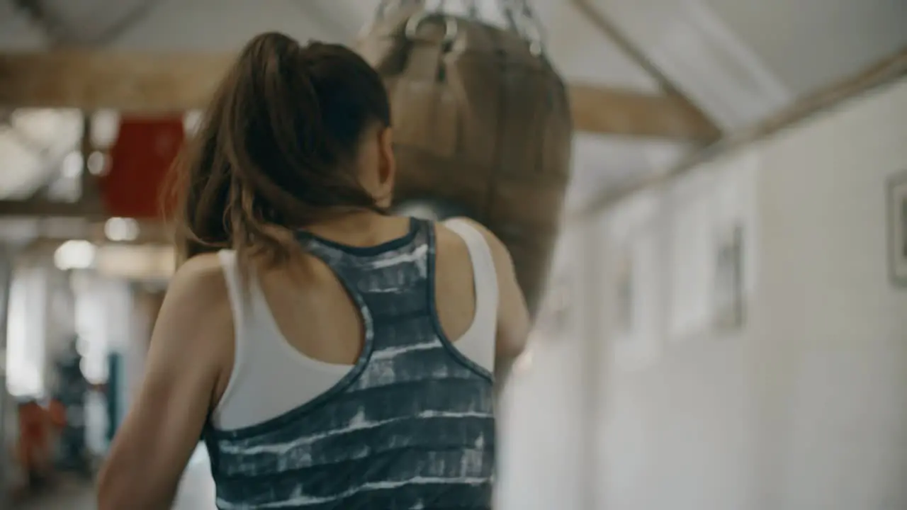 Woman Training with Boxing Bag