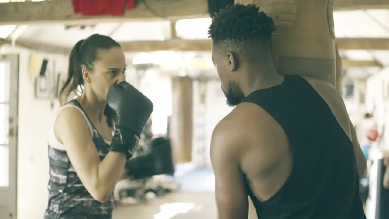 Novice Boxer Training in Gym