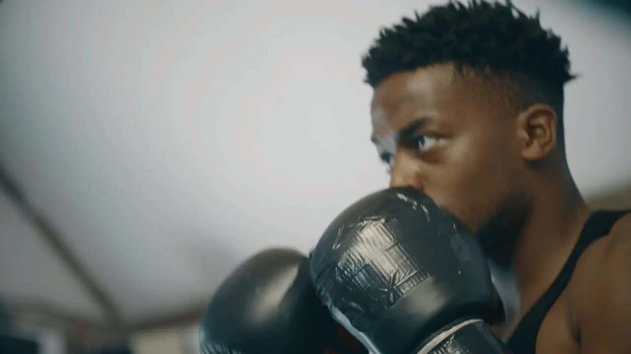 Close Up Shot of Boxer Punching Pads in Ring