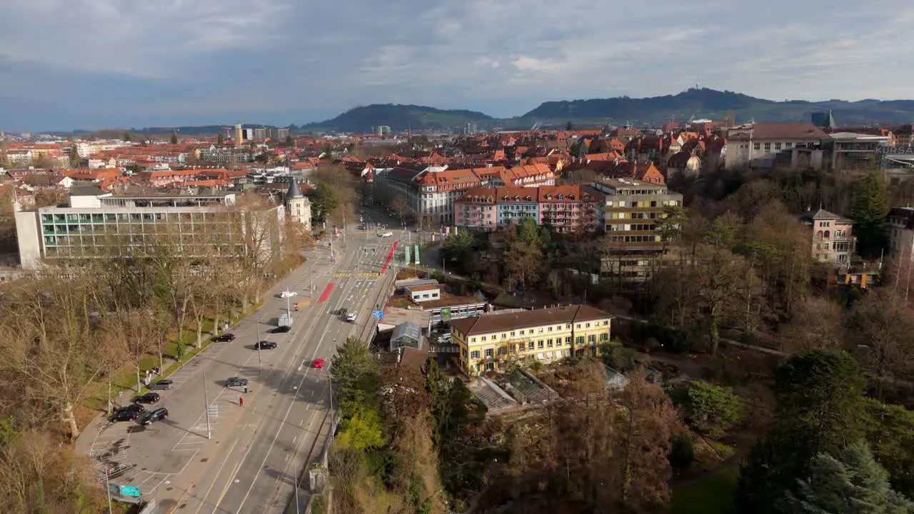 Cars driving on highway street road in Bern city residential area