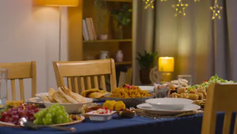 Food On Muslim Muslim Family Table At Home Set For Meal Celebrating Eid