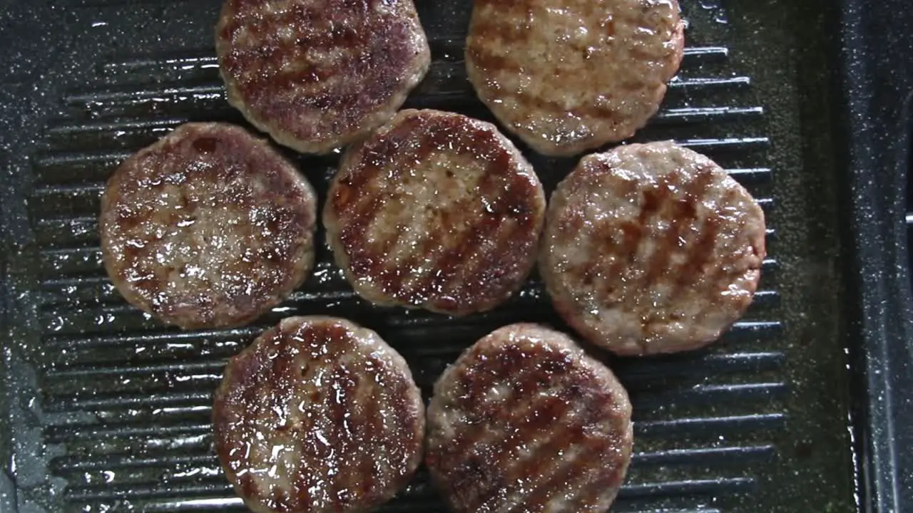 Grilled burger patties moving around in microwave effect