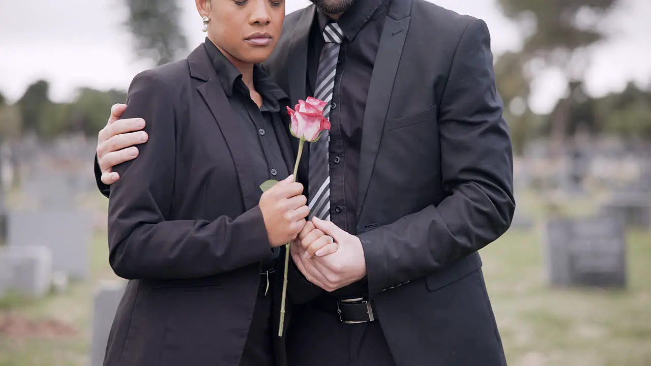 Rose death or couple in cemetery for funeral