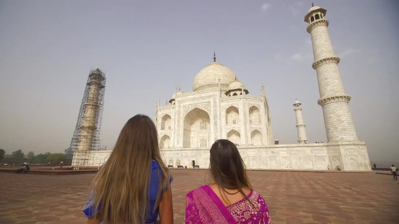 Two Women Looking at the Taj Mahal