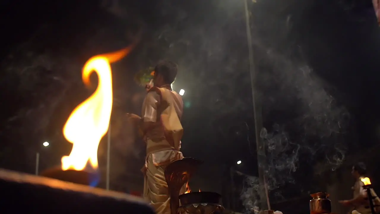 Men Waving Ceremonial Ganga Aarti Fans