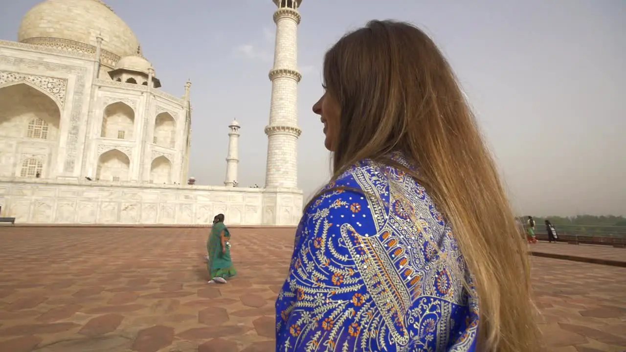 Orbiting Shot of Two Women at the Taj Mahal