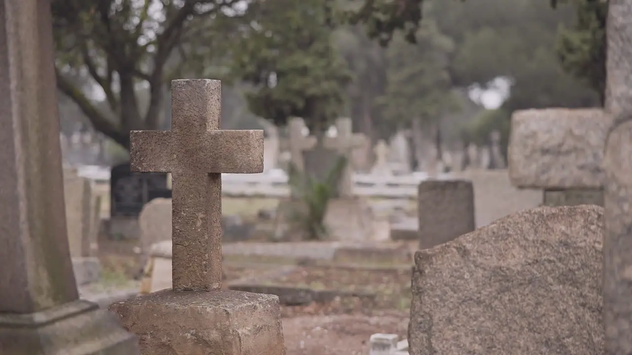 Funeral cemetery and cross on tombstone for death