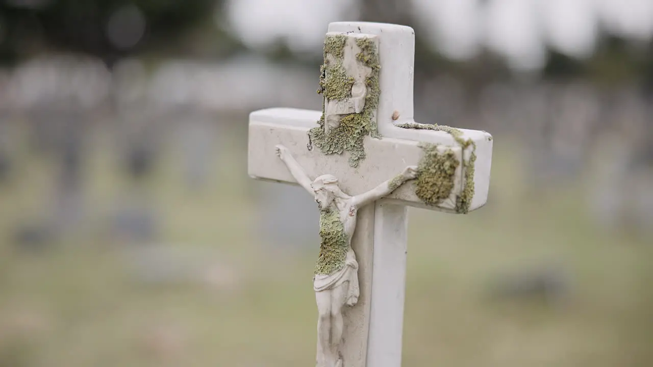 Funeral tombstone or jesus on cross in graveyard