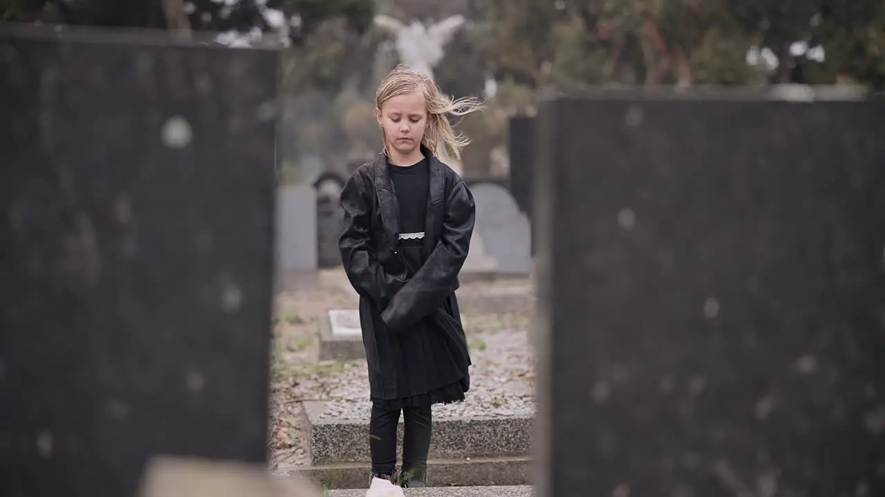 Sad death or kid in cemetery for funeral