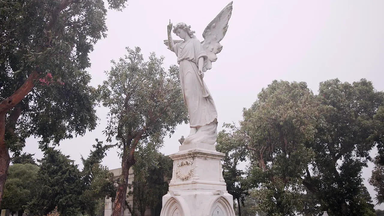 Funeral graveyard and angel on tombstone