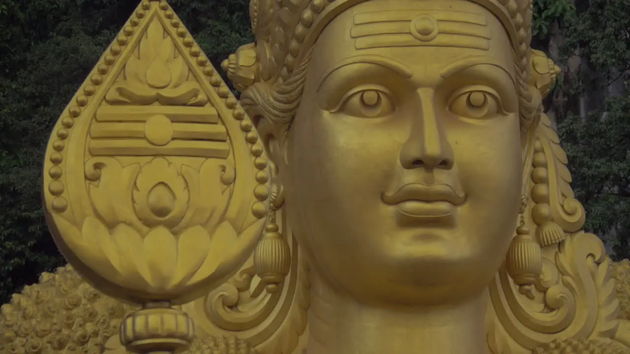 Close-up of head of statue of Murugan at Batu Caves Malaysia