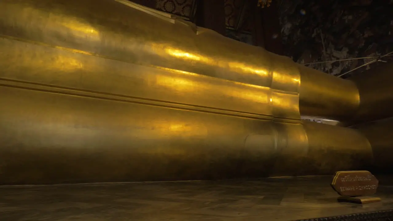 Seen a large golden statue of the reclining Buddha