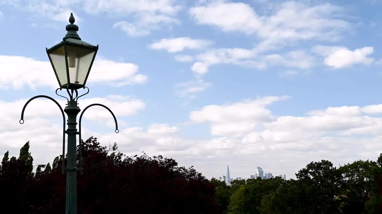 Time-Lapse of an Old Street Lamp at Horniman Museum and Garden in London with Clouds Across the Blue Skies