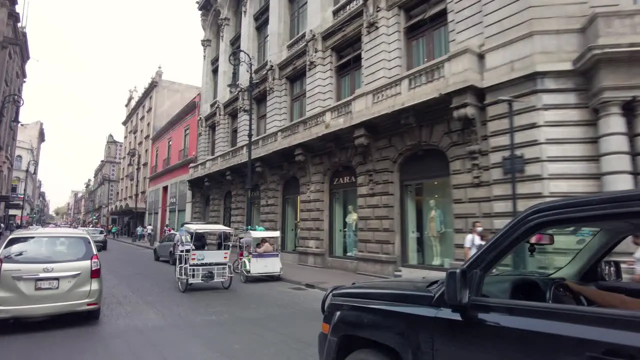 Traffic on the streets of Mexico's City downtown shot from a car perspective