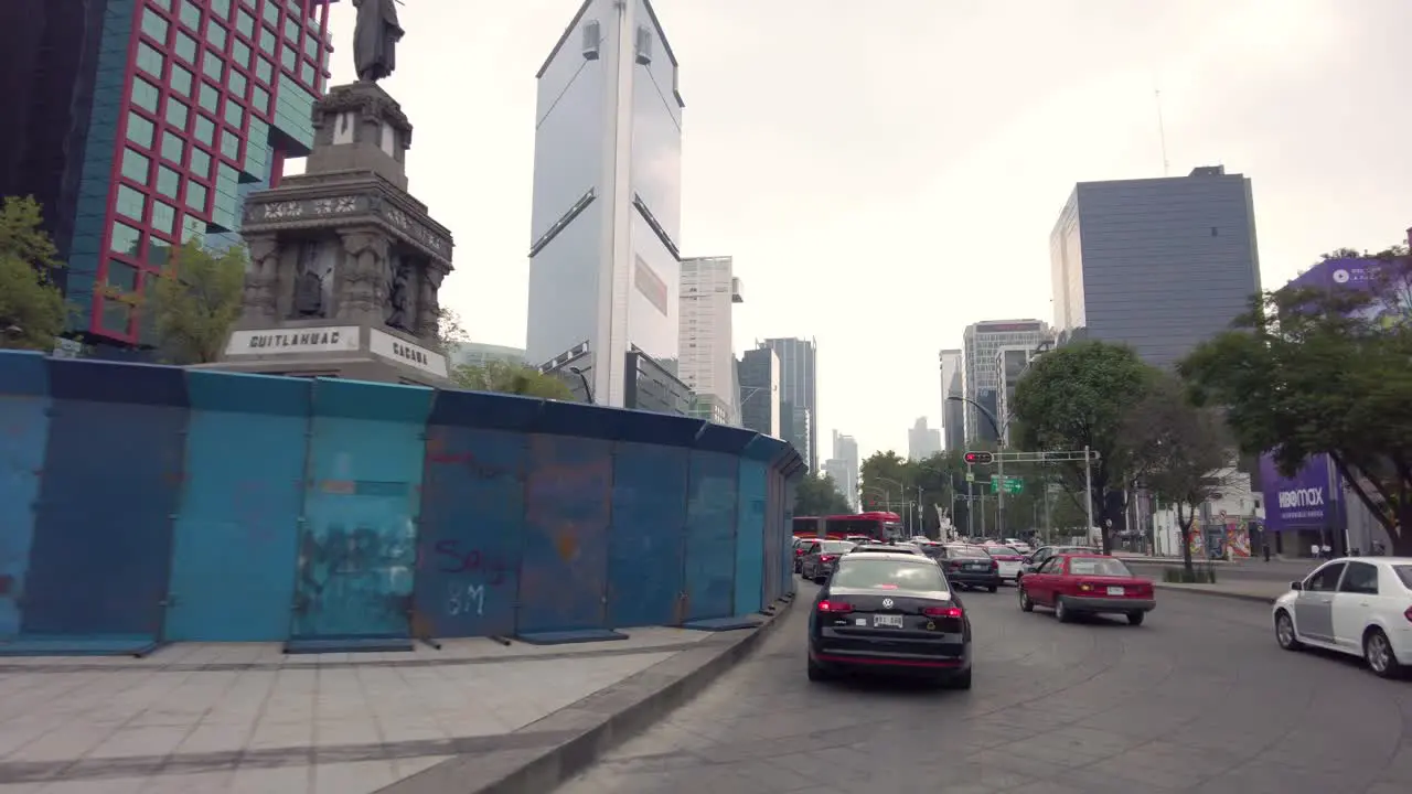 Touring through the streets of Mexico's City downtown shot from a car perspective