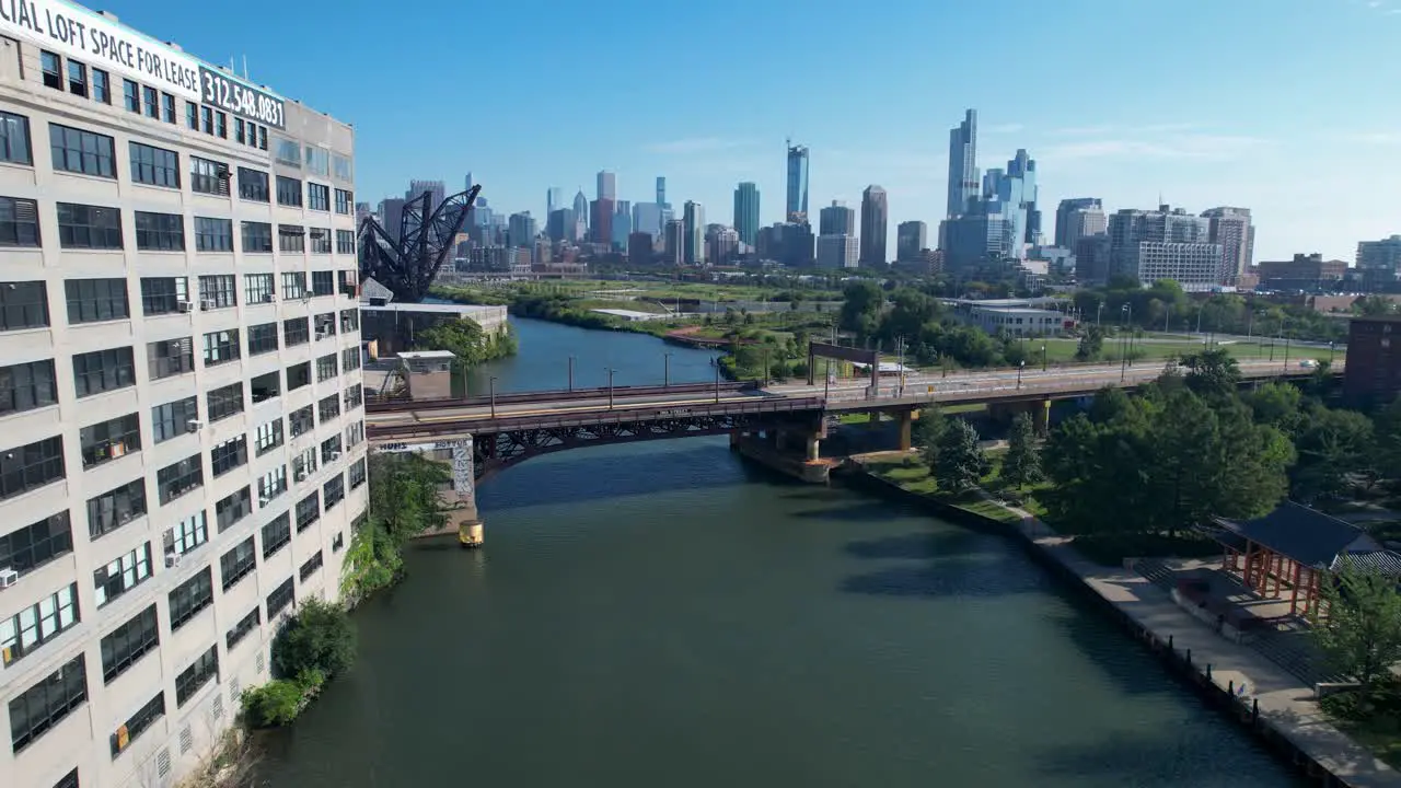 Reveling Shot Of Chicago Skyline And 18th Street Bridge Passing Building Next To River