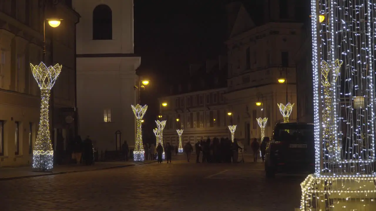 Christmas Lighting Decoration Old Cobblestone Streets of Old Town Warsaw Poland with People Walking by