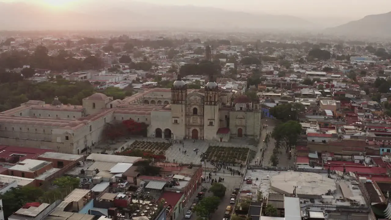 Aerial is flying around Santo Domingo Temple during early morning Oaxaca Mexico