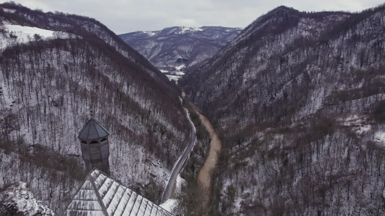 Flying beside the Kuslat Mosque from the ottoman period in Bosnia and Herzegovina with a beautiful canyon landscape