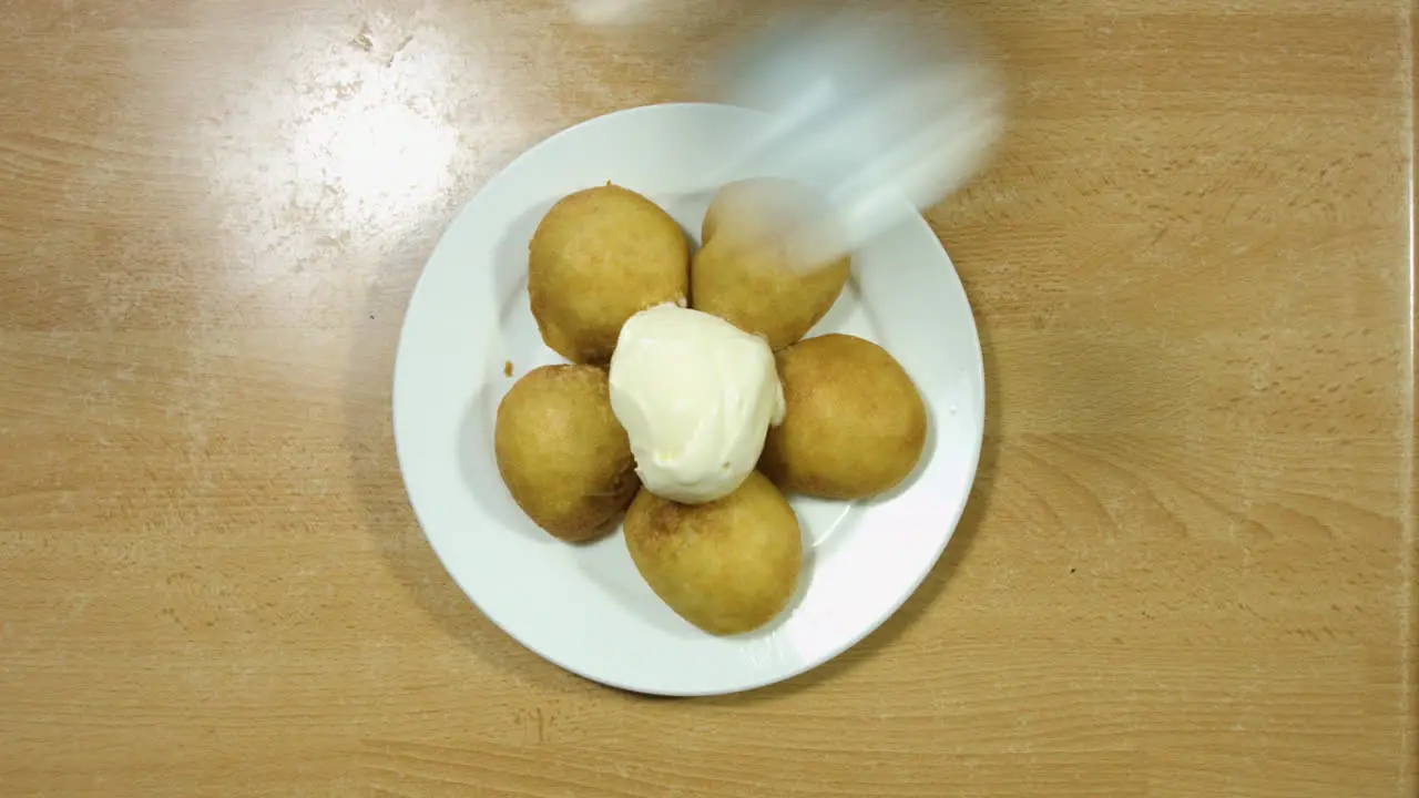 Top Shot Of Fried Ores With Ice Cream On Top And A Drizzle Of Chocolate Sauce