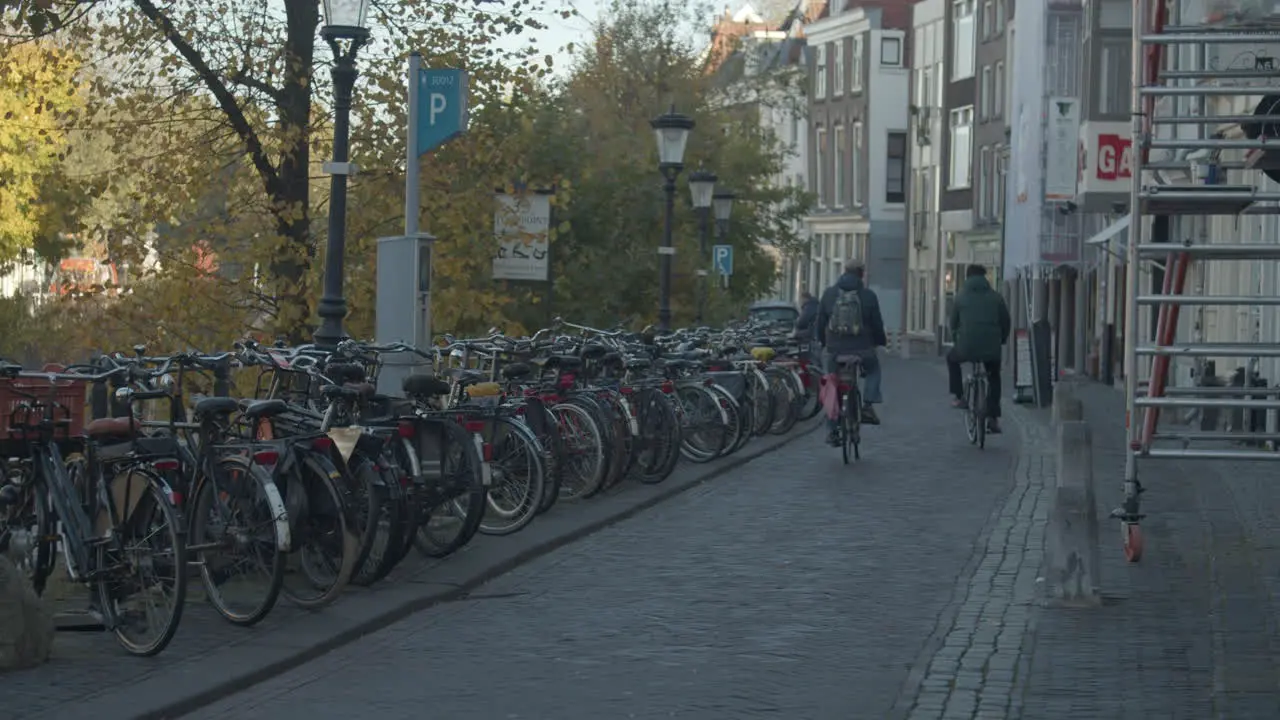 bicyclists cycling over street in the old center of Utrecht the Netherlands