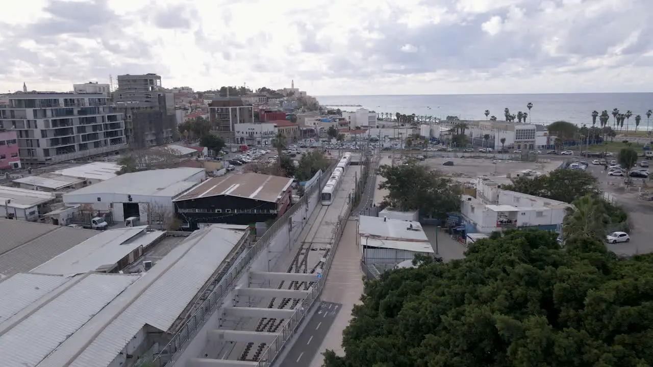 Aerial drone view of metro arriving at Elifelet metro station in Tel Aviv