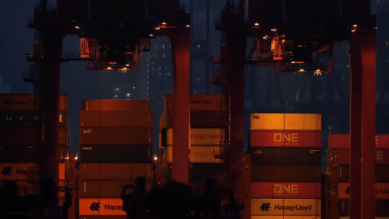 The industrial port crane lifts the loading export containers box onboard at the port