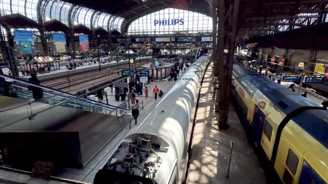 18 April 2023 Inside View Of Hamburg Hauptbahnhof Looking Down At ICE Train Arriving At Platform