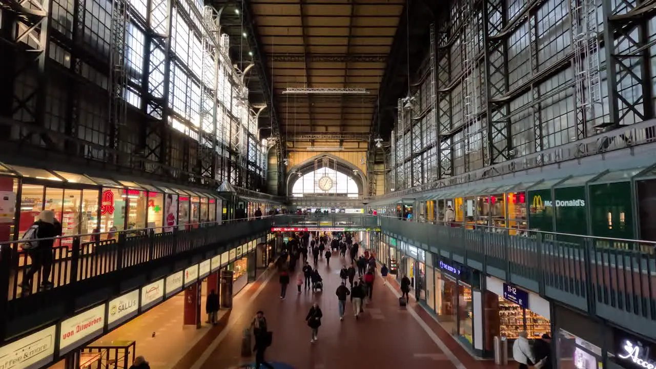 Inside View Of The Impressive Hall At Hamburg Central Station With Shops And Travellers Walking Past